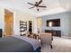 Bright main bedroom with large TV and sitting area at 4204 Sevan Way, Kissimmee, FL 34746