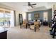 Spacious main bedroom with pool view and sitting area at 4204 Sevan Way, Kissimmee, FL 34746
