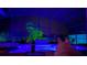 Luminous night scene of a pool and spa with colorful lighting at 4204 Sevan Way, Kissimmee, FL 34746