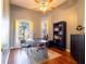 Home office with built-in shelving and hardwood floors at 4204 Sevan Way, Kissimmee, FL 34746