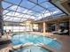 Relaxing pool area with patio furniture and screened enclosure at 4204 Sevan Way, Kissimmee, FL 34746