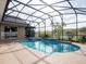 Inviting screened pool and spa with tiled accents at 4204 Sevan Way, Kissimmee, FL 34746