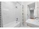 Bathroom with marble-look tile and a walk-in shower at 1716 Palmer Ave, Winter Park, FL 32789