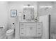 Bathroom with white vanity, toilet and marble tile at 1716 Palmer Ave, Winter Park, FL 32789