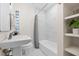 Clean bathroom with white tub and subway tile at 1716 Palmer Ave, Winter Park, FL 32789