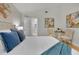 Bright bedroom with a queen bed and wood floors at 1716 Palmer Ave, Winter Park, FL 32789