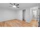 Bedroom with hardwood floors, closet and access to bathroom at 1716 Palmer Ave, Winter Park, FL 32789