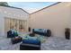 Evening view of an inviting courtyard with seating area and string lights at 1716 Palmer Ave, Winter Park, FL 32789