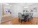 Dining room with hardwood floors, chandelier, and modern table set at 1716 Palmer Ave, Winter Park, FL 32789