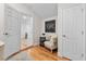 Bright hallway with hardwood floors and built-in seating area at 1716 Palmer Ave, Winter Park, FL 32789