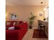 Cozy living room flows into kitchen and bar seating at 308 New Providence # 308, Davenport, FL 33897