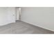 Bedroom featuring carpeted floors and a view of a bathroom entryway at 6086 Sacred Oak Ave, Mount Dora, FL 32757