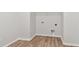 Spacious walk-in closet with hardwood floors and white wire shelving for optimal storage at 6086 Sacred Oak Ave, Mount Dora, FL 32757
