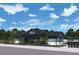 Community clubhouse featuring a covered porch and ample parking at 6086 Sacred Oak Ave, Mount Dora, FL 32757