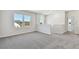 Spacious living room with neutral carpet, recessed lighting, and natural light at 6086 Sacred Oak Ave, Mount Dora, FL 32757
