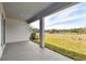 Covered patio with views of green space at 6086 Sacred Oak Ave, Mount Dora, FL 32757