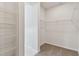 Walk-in closet offering ample storage space with shelving at 6086 Sacred Oak Ave, Mount Dora, FL 32757