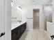 Modern bathroom with double vanity and walk-in shower at 6075 Sacred Oak Ave, Mount Dora, FL 32757