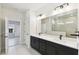 Modern bathroom with double vanity and walk-in shower at 6075 Sacred Oak Ave, Mount Dora, FL 32757