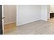 Light and airy bedroom with wood-look floors and closet at 6075 Sacred Oak Ave, Mount Dora, FL 32757
