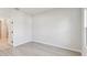 Bright bedroom features light gray flooring and ample natural light from a window at 6075 Sacred Oak Ave, Mount Dora, FL 32757