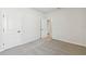 Spacious bedroom with carpet and access to other rooms at 6075 Sacred Oak Ave, Mount Dora, FL 32757