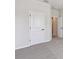 Bedroom with carpet, door, and access to other rooms at 6075 Sacred Oak Ave, Mount Dora, FL 32757