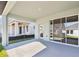 Covered patio with sliding glass doors and view of backyard at 6075 Sacred Oak Ave, Mount Dora, FL 32757