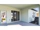 Covered patio with sliding glass doors at 6075 Sacred Oak Ave, Mount Dora, FL 32757