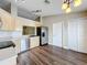Bright kitchen with stainless steel appliances, sleek countertops, and wood look flooring at 7713 Manor Dr, Lakeland, FL 33810