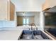 The kitchen features a black double sink, lots of counter space and a view into the living area at 7713 Manor Dr, Lakeland, FL 33810