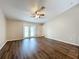 Spacious living room with wood floors, plenty of natural light, and neutral paint at 7713 Manor Dr, Lakeland, FL 33810