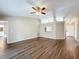 Open-concept living room with modern flooring, neutral paint, and a clear view to the kitchen at 7713 Manor Dr, Lakeland, FL 33810