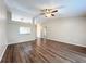 Bright living area showcasing modern floors, neutral decor, and an open layout at 7713 Manor Dr, Lakeland, FL 33810