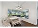 Cozy breakfast nook with booth seating and a large window overlooking the backyard at 5407 County Road 125, Wildwood, FL 34785