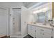 Bathroom boasts double vanity and a separate shower at 4042 Stonehenge Rd, Mulberry, FL 33860