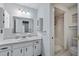 Clean bathroom with vanity, shower, and tile floors at 4042 Stonehenge Rd, Mulberry, FL 33860