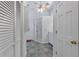 Clean bathroom with shower, tile floors, and white vanity at 4042 Stonehenge Rd, Mulberry, FL 33860