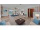 Bright and airy living room with tile floors and dining area at 4042 Stonehenge Rd, Mulberry, FL 33860