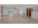 Spacious living area featuring tile flooring and access to the pool at 4042 Stonehenge Rd, Mulberry, FL 33860