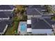 Aerial view showing a home with a private pool and spa in the backyard at 116 Prestwick Grande Dr, Daytona Beach, FL 32124