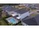 Aerial view of house with pool and spa; located in a quiet residential neighborhood at 116 Prestwick Grande Dr, Daytona Beach, FL 32124