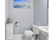 Simple half bathroom with pedestal sink and toilet at 116 Prestwick Grande Dr, Daytona Beach, FL 32124