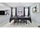 Elegant dining room features a dark wood table and black chairs, with access to the living room at 116 Prestwick Grande Dr, Daytona Beach, FL 32124