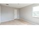 Bright bedroom with light grey walls and wood flooring at 836 Kensington St, Lakeland, FL 33803