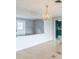 Spacious dining room with light floors, neutral walls, and a crystal chandelier at 836 Kensington St, Lakeland, FL 33803