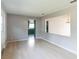 Dining room with hardwood floors and an open view to the kitchen at 836 Kensington St, Lakeland, FL 33803