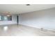 Living room with wood floors and view into dining area at 836 Kensington St, Lakeland, FL 33803