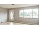 Living room with light floors, neutral walls, and a large window offering ample natural light at 836 Kensington St, Lakeland, FL 33803