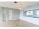 Light-filled living room with hardwood floors and a chandelier at 836 Kensington St, Lakeland, FL 33803